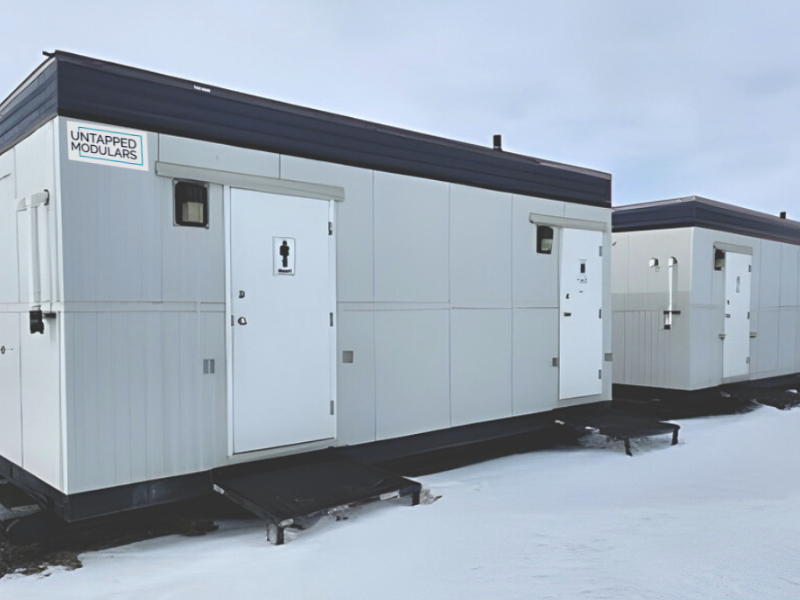 Grey jack and Jill lavatory modular exterior with grey sky and snowy foreground