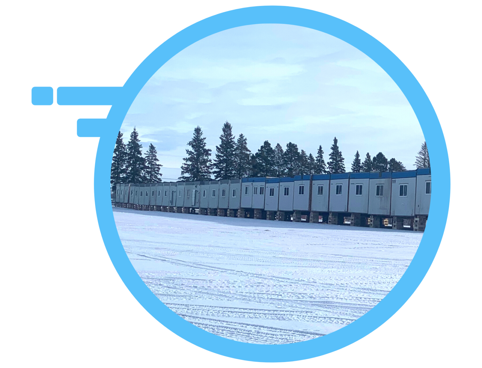 Several modular 12X60 in a row with snow on the ground